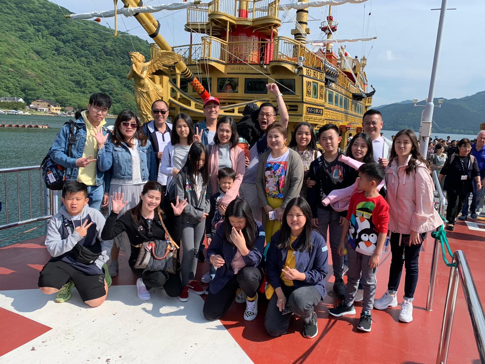 A serene cruise across Lake Ashi with views of the mountain peaks.